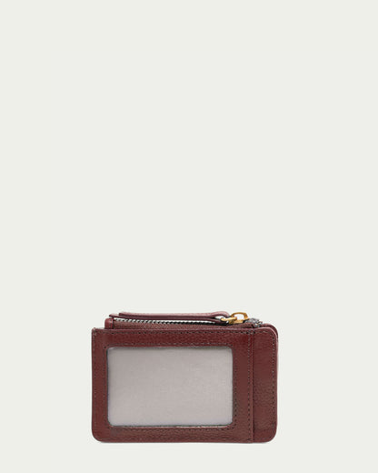 The American Leather Co. Portland Wallet With RFID, made of brown glove-tanned leather, has a transparent ID window and top zipper, elegantly displayed against a plain light background.