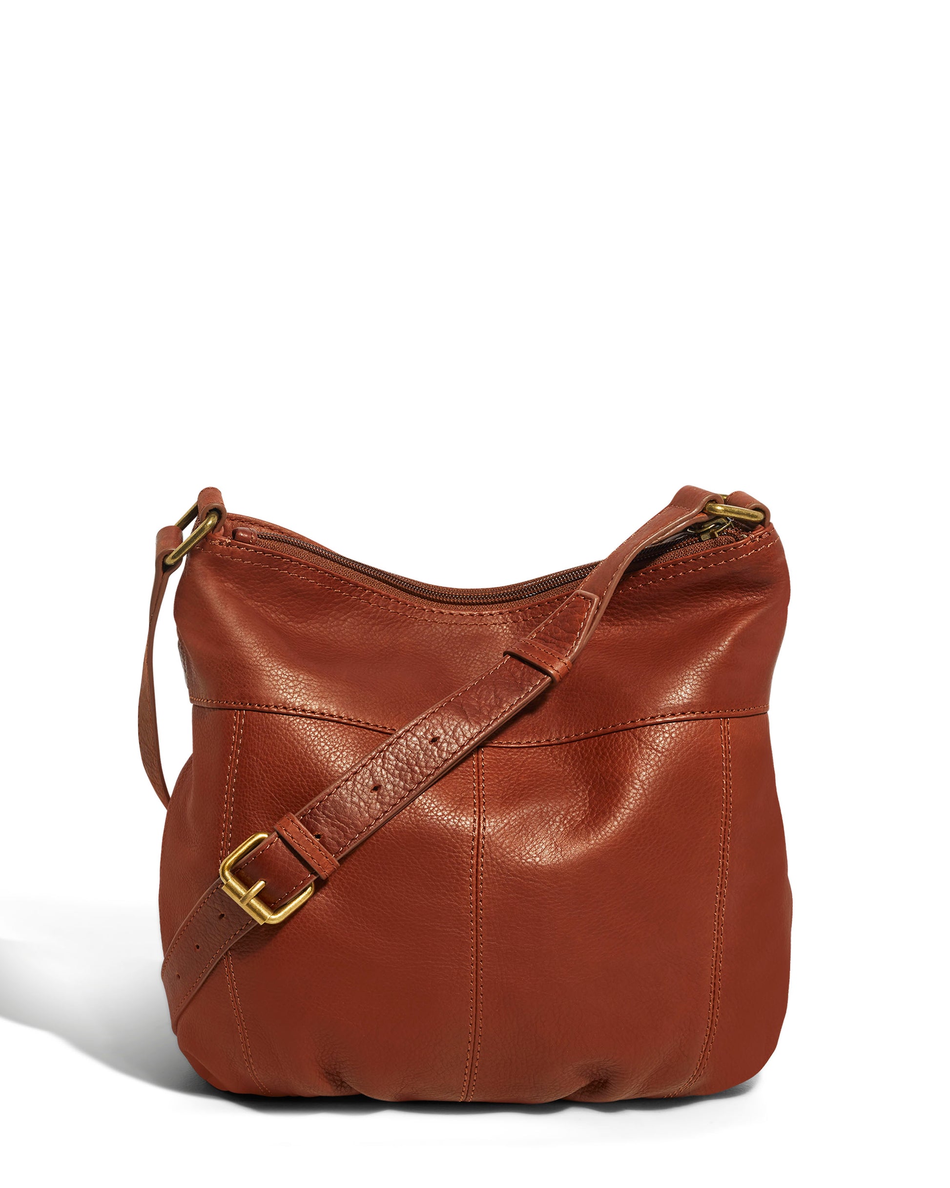 Introducing the Acorn Double Entry Crossbody by American Leather Co., crafted from authentic glove leather and adorned with antiqued hardware. This chic bag features a gold buckle on its adjustable strap, complemented by a zippered top for added security and a sleek, minimalist design set against a white background.