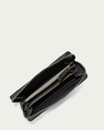 The Austin Continental Wallet with RFID by American Leather Co. is open to reveal a spacious interior with multiple compartments for cards, cash, and a central zippered coin pocket. Featuring RFID protection, the black leather wallet is displayed against a plain light background.