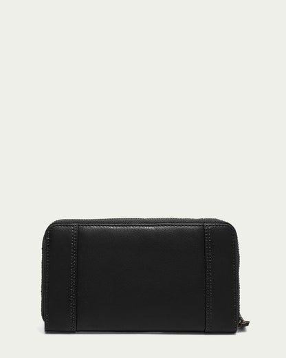 The Austin Continental Wallet with RFID from American Leather Co. is displayed against a plain off-white background. This black leather wallet features a zip-around closure, simple stitched details, and RFID protection, boasting a sleek, minimalist design ideal for any occasion.