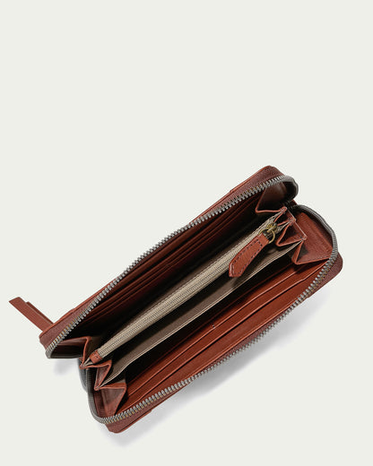 The Austin Continental Wallet by American Leather Co. is an open brown leather wallet featuring a zipper, multiple compartments, an interior zippered pocket, and RFID protection. It is lined with tan fabric and set against a plain, light background.