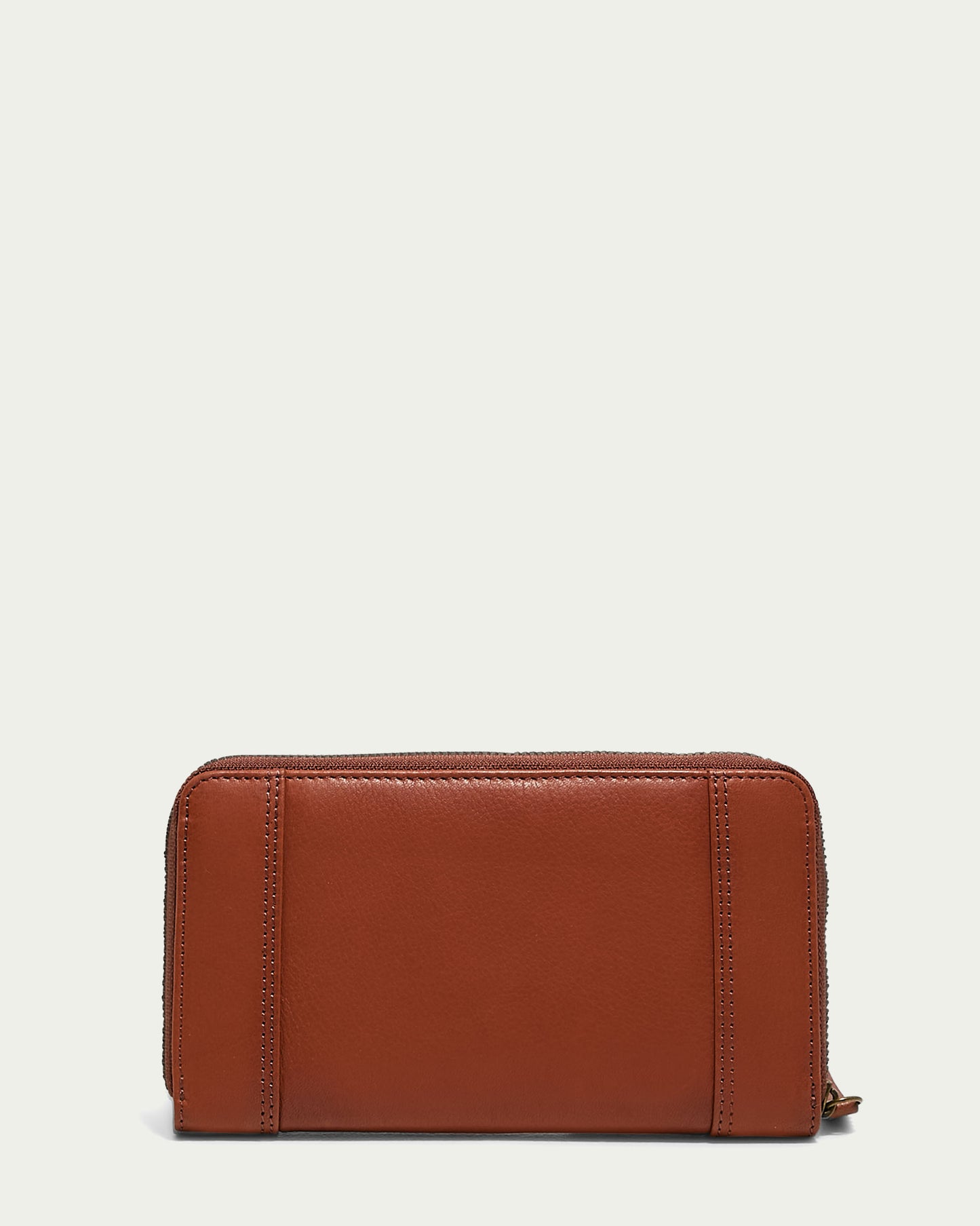 The Austin Continental Wallet by American Leather Co. features a zip-around closure and minimalist design, with subtle stitching and RFID protection. Its sleek leather finish stands out on a plain light background, ensuring style and security.