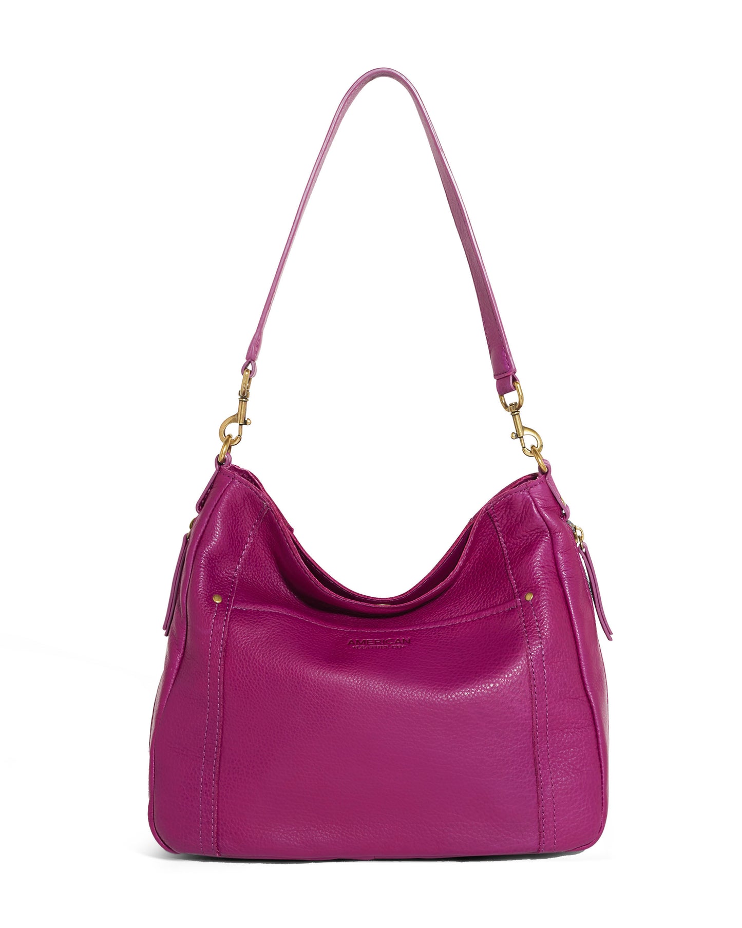 The Austin Shoulder bag from American Leather Co. is a vibrant magenta leather handbag with a single shoulder strap and antiqued hardware. It showcases a sleek design with subtle stitching and seems to offer a spacious interior. Crafted from Genuine American Leather, the brand name is subtly embossed on the front. The backdrop is plain white.