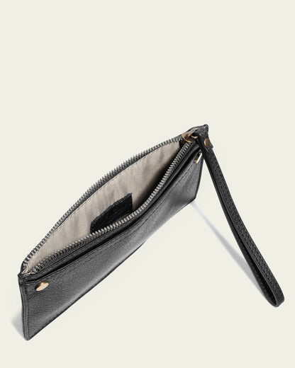 A sleek silhouette in black leather, the Bristow CC Zip Wallet Wristlet with RFID from American Leather Co. features a zippered opening that partially reveals its light-colored interior. This slim wallet wristlet includes a wrist strap and two gold-colored rivets set against a plain, light-colored background.