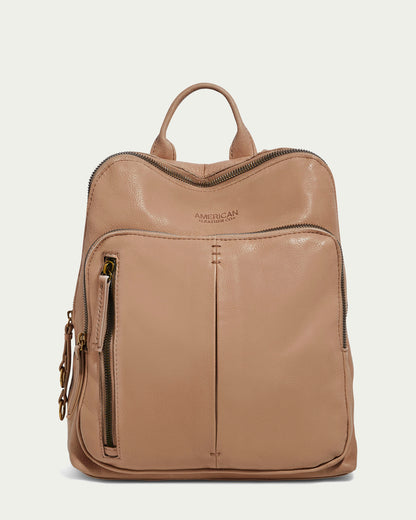 The Cleveland Backpack by American Leather Co. is a tan leather purse featuring a top handle and multiple zippers, including a vertical front pocket. Crafted from buttery soft leather with a smooth surface, the brand name is embossed near the top.