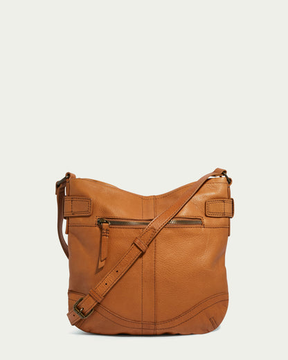 The Elton Crossbody by American Leather Co. is a vintage crossbody bag made from genuine American leather, featuring a front zip pocket, adjustable strap, and antiqued hardware, elegantly displayed against a plain light background.