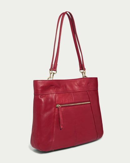 The Alpine Triple Compartment Tote from American Leather Co. is a sleek, genuine red leather handbag with double shoulder straps. It features a front zipper pocket with a gold zipper and two vertical seam accents, offering excellent organizational capabilities.