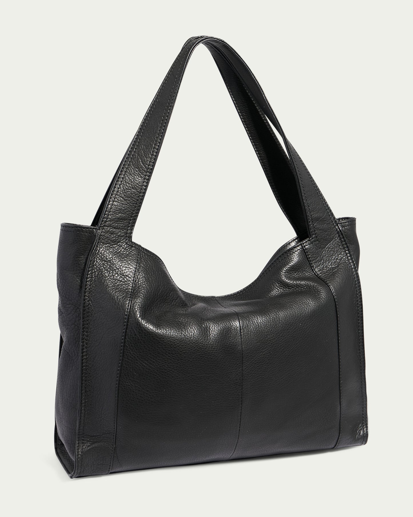 The sleek black Plymouth Ziptop Tote by American Leather Co. is a Genuine Leather handbag with a rectangular shape and two wide shoulder straps. It features a smooth, textured design with subtle seam details running vertically down the front, set against a plain white background.