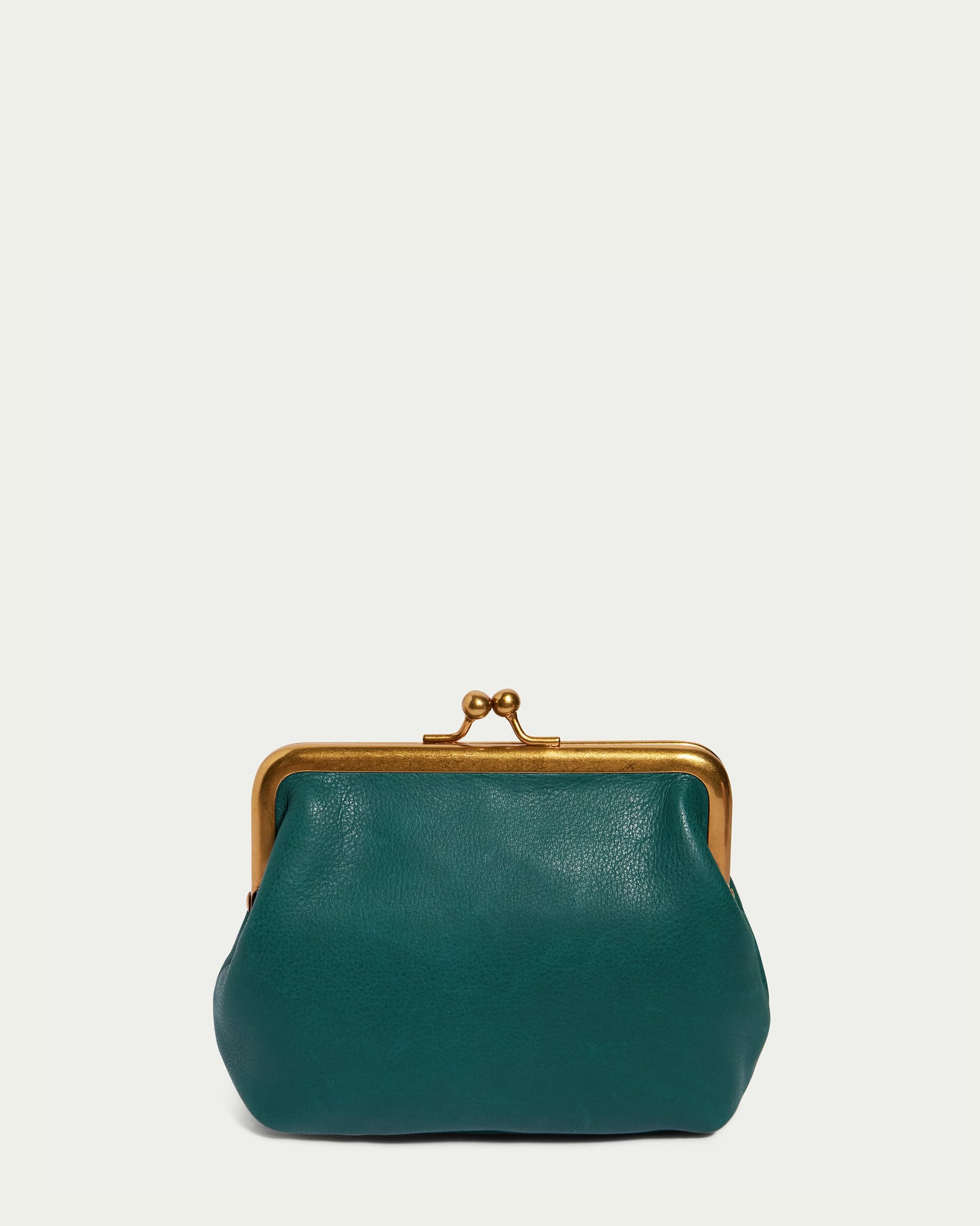 A small, green genuine leather Kisslock Wallet from American Leather Co. showcases a gold metal clasp against a plain off-white background. This framed kisslock purse has a soft, rounded shape.