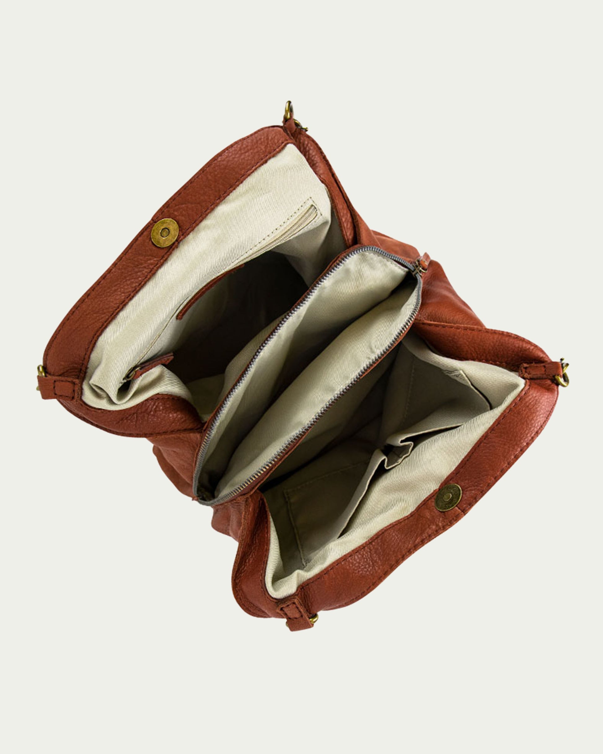 The Austin Triple Entry Hobo by American Leather Co. is an open brown leather purse with a beige interior, crafted from genuine leather. It features multiple compartments, including a zipper pocket, and is styled with brass buttons and buckles, making it an ideal casual accessory.