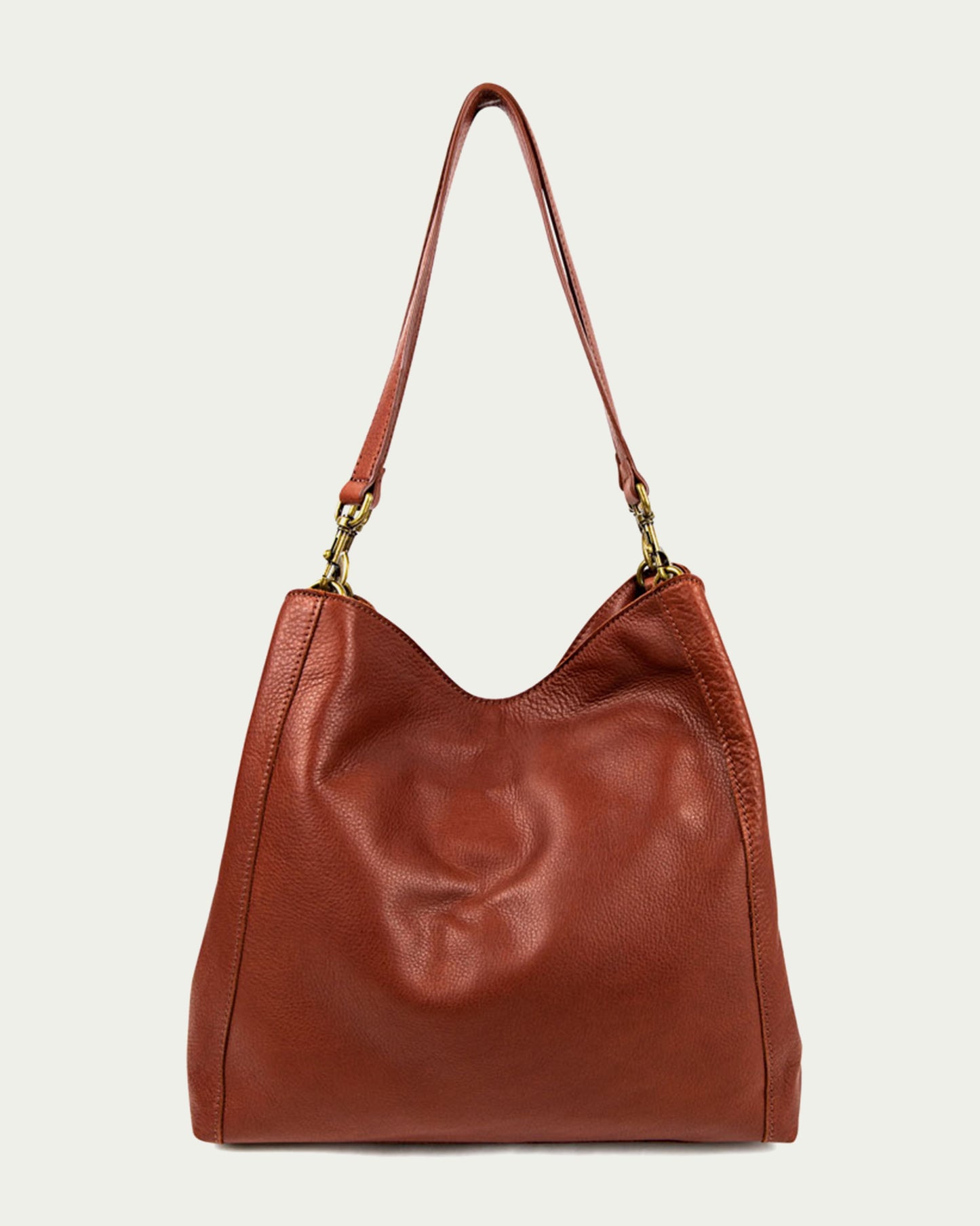 The Austin Triple Entry Hobo from American Leather Co. is a casual brown genuine leather bag with a single strap and brass hardware, showcased against a plain background. It features a soft, slouchy design with visible texture.