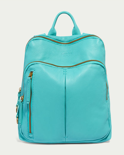 The Cleveland Backpack by American Leather Co. is crafted in a Blue Lagoon leather with a smooth texture and gold zippers. It features a large main compartment, a zippered front pocket, two side pockets, a sturdy top handle, and adjustable back straps for added convenience.