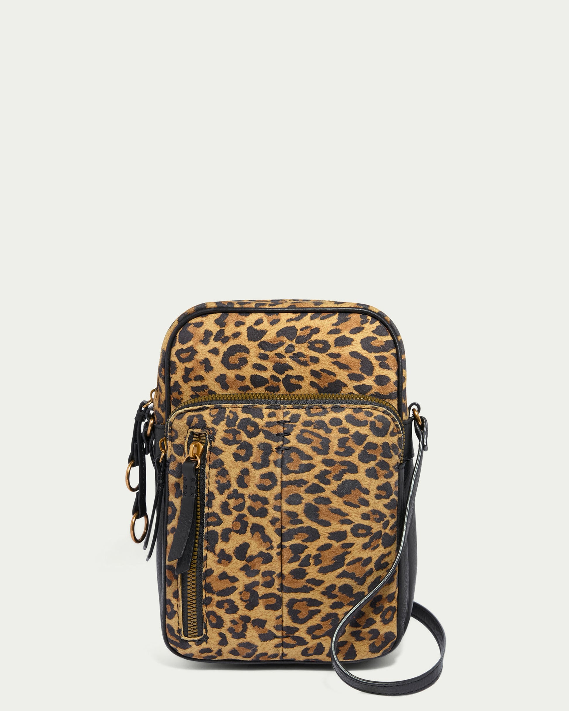 Introducing the Cleveland Large NS Crossbody by American Leather Co.: a genuine leather leopard print bag featuring a front zipper pocket, gold hardware accents, and black adjustable strap. This sleek, compact design is perfect for any occasion.