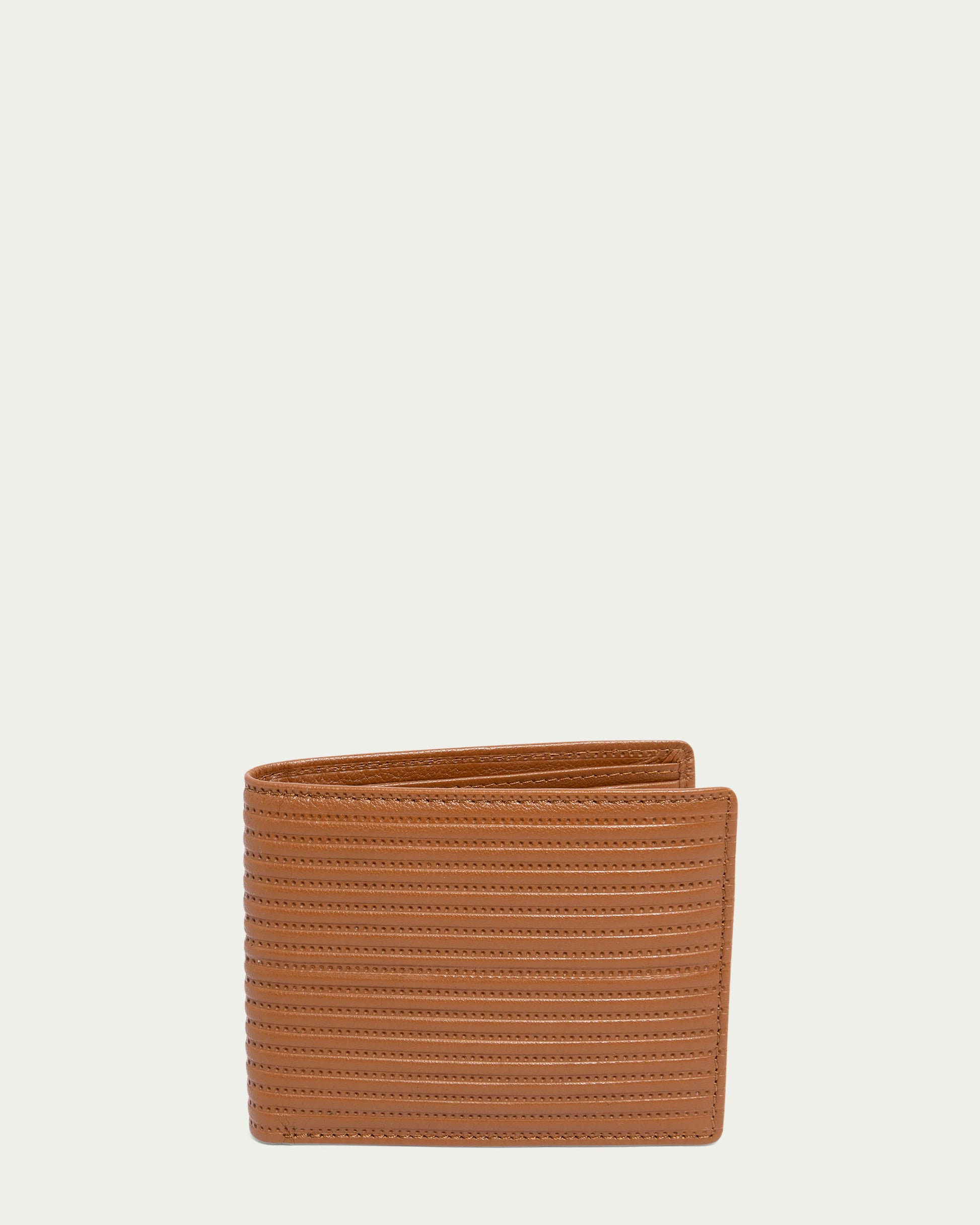 Against a white background, the partially open Shorewood Bifold Wallet by American Leather Co. in brown textured nappa leather reveals its compartments, exemplifying the sophistication of a men’s leather collection.