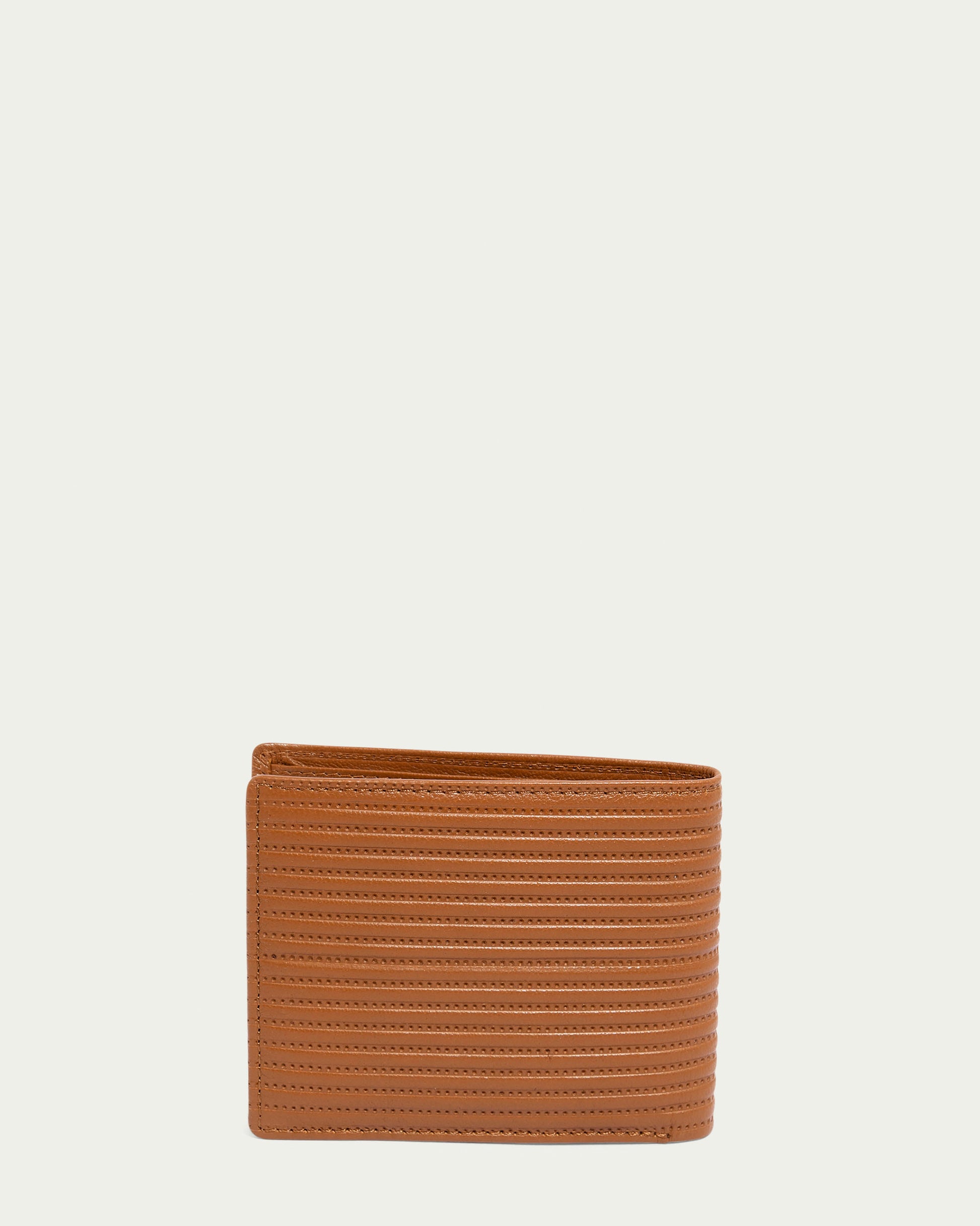 The Shorewood Bifold Wallet by American Leather Co. features an exquisite brown nappa leather with a textured, ribbed pattern exterior, standing upright against a plain, light background—ideal for any men's leather collection.