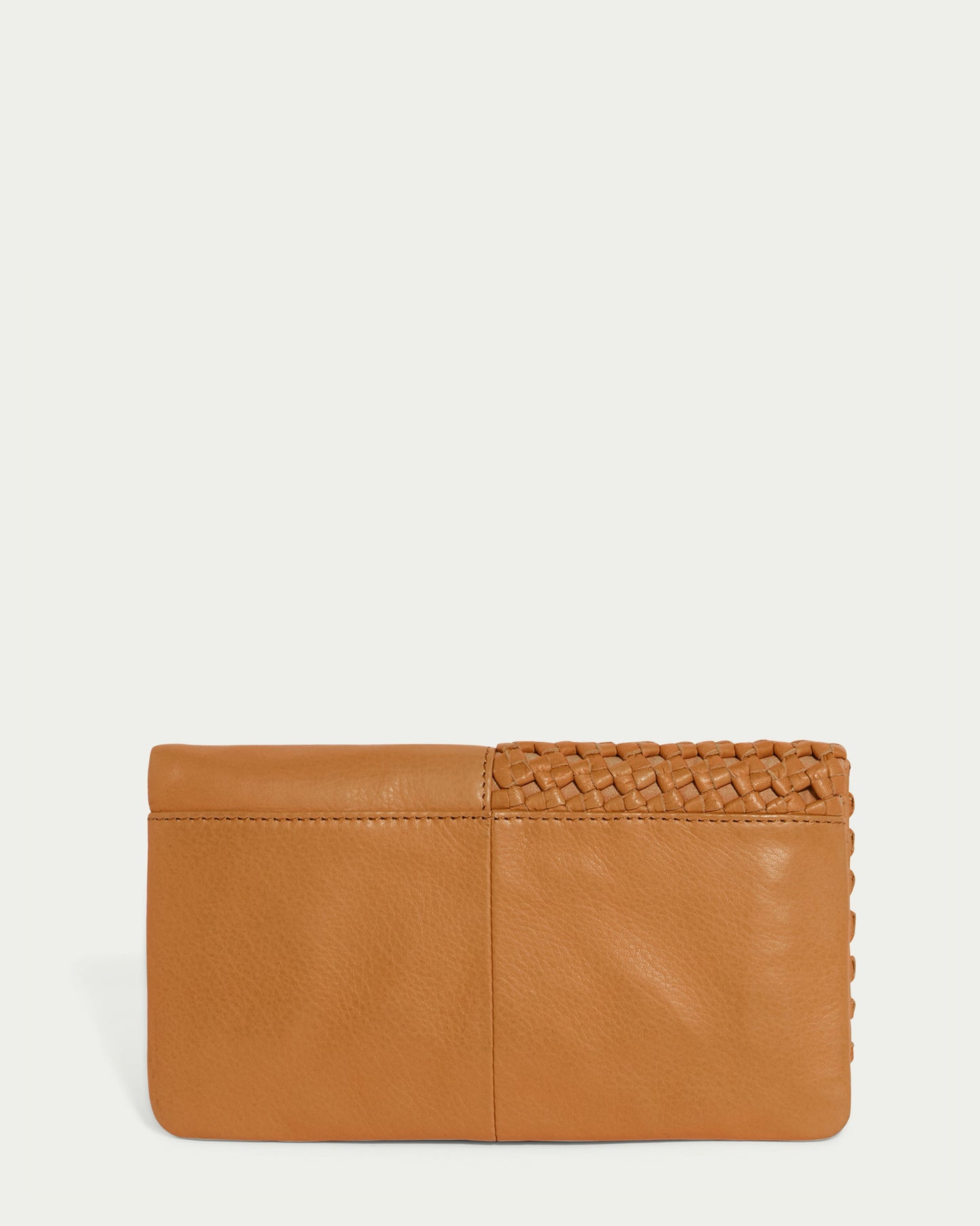 The Webster Woven Bifold Wallet by American Leather Co. is a tan leather accessory with a simple design that highlights the supple quality of its material. The smooth surface is enhanced by woven details on the right side, adding texture and interest.