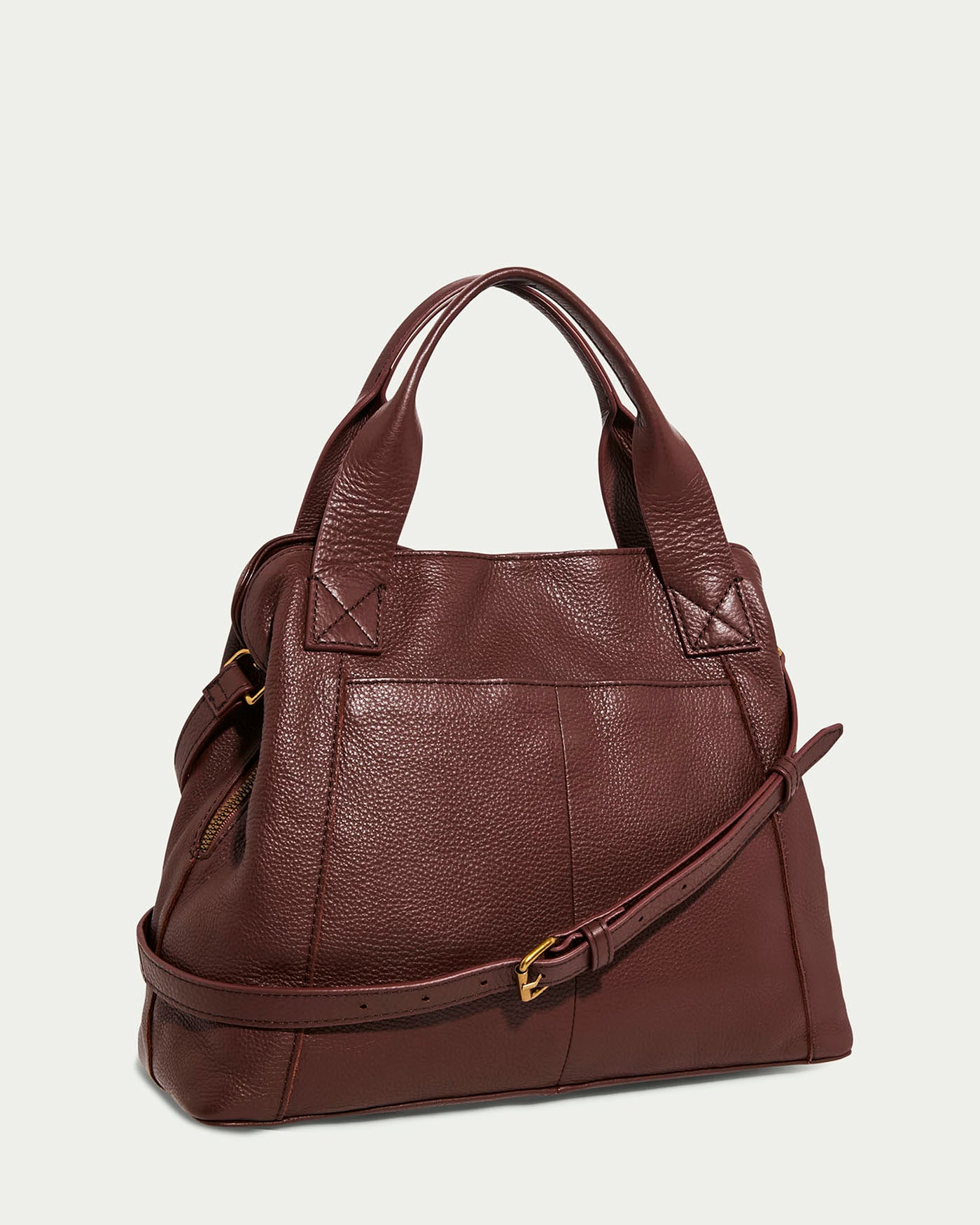 The Ada Triple Entry Satchel by American Leather Co. is a rich brown genuine leather bag with dual handles and an adjustable crossbody strap. It features a textured surface and zippered closure against a plain light background, combining style with functionality.