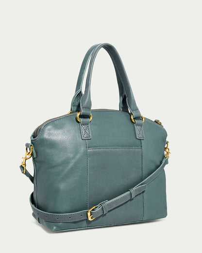 The Carrie Dome Satchel by American Leather Co. is a stylish teal leather bag with a smooth finish, dual handles, and an adjustable crossbody strap. Made from genuine American leather, it features gold-toned hardware and a front pocket for extra storage.