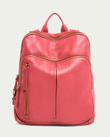 The Cleveland Backpack from American Leather Co. is in French Rose, made of genuine leather with a subtle texture. It features a top handle, adjustable back straps, and gold zippers on the main compartment, front pocket, and vertical side pocket; the brand name is embossed on the front.