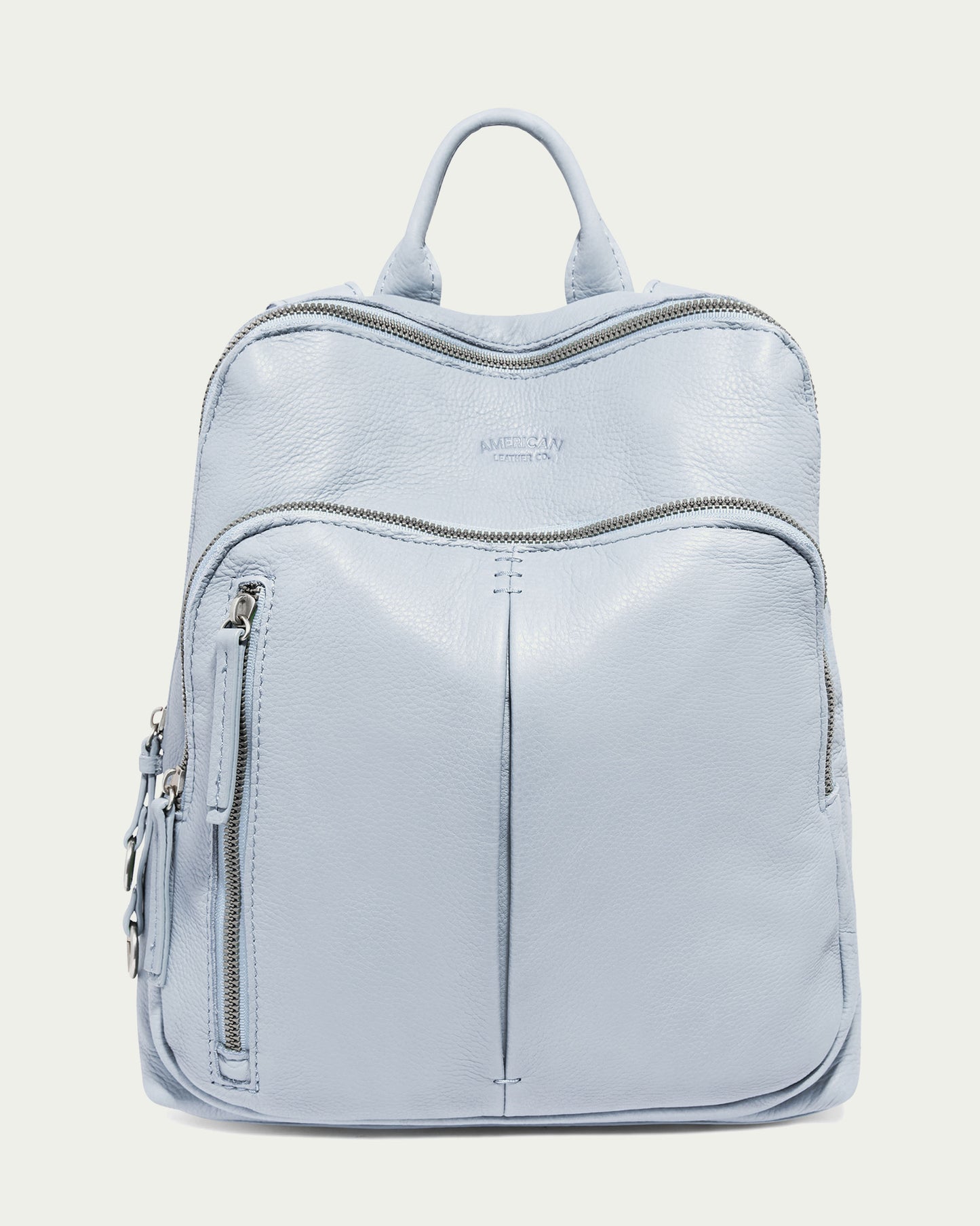 The Cleveland Backpack by American Leather Co. in Oasis Blue features a genuine leather top handle, multiple zippers and pockets, sleek modern design with subtle stitching, and adjustable straps for comfort.