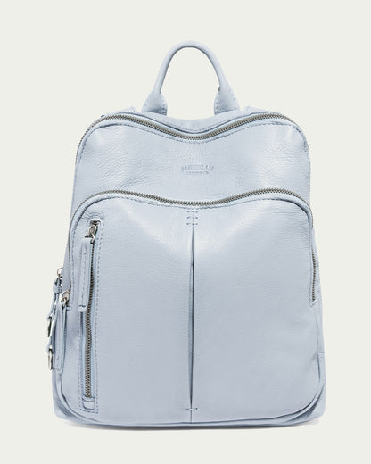 The Cleveland Backpack by American Leather Co. in Oasis Blue features a genuine leather top handle, multiple zippers and pockets, sleek modern design with subtle stitching, and adjustable straps for comfort.