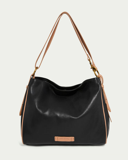 Introducing the Dean Double Entry Convertible Hobo by American Leather Co., a stylish black glove leather bag with nutmeg straps and accents. Its slouchy shape, gold hardware, and adjustable strap offer flair and functionality, while an embossed leather tag graces the front.