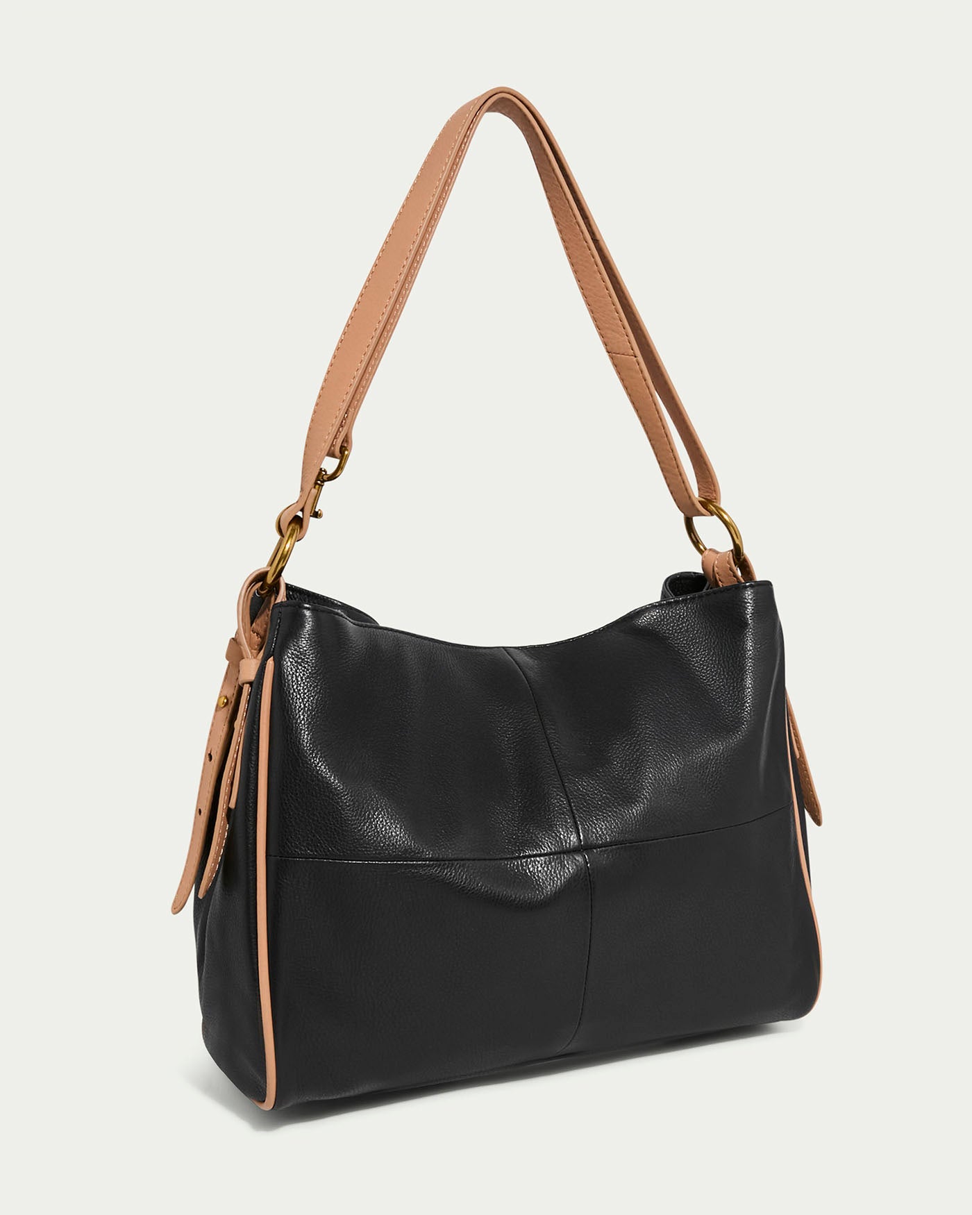 Introducing the Dean Double Entry Convertible Hobo by American Leather Co., a chic black glove leather handbag with tan handles and side straps, gold-tone hardware, and an adjustable strap. Its smooth, minimalist design suits both casual and formal events.