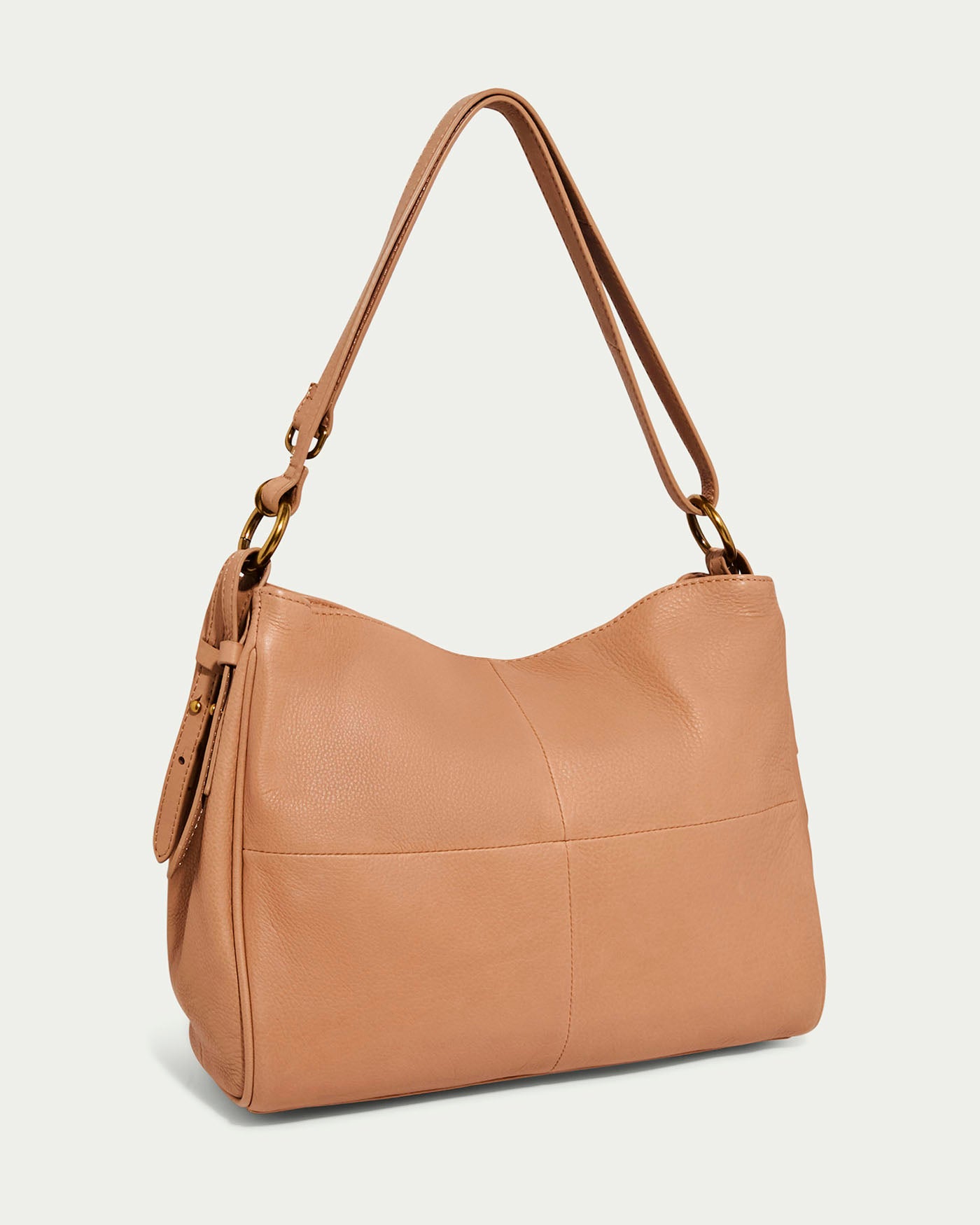 The Dean Double Entry Convertible Hobo by American Leather Co. is a tan glove leather shoulder bag with a minimalist design, featuring an adjustable strap and subtle stitching on a light background, perfect for any occasion.