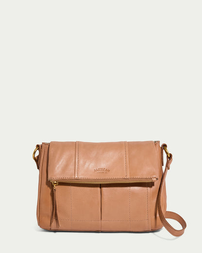 The Lee Double Entry Crossbody by American Leather Co. in Nutmeg is a genuine leather bag with a front zip pocket, subtle stitching, and an embossed logo. It includes an adjustable, detachable strap and boasts a smooth finish with a casual yet sophisticated design.