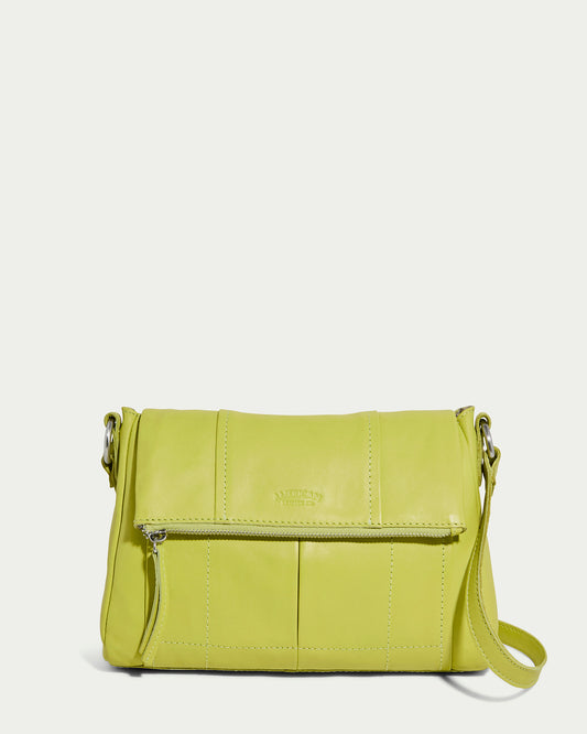 The American Leather Co.'s Lee Double Entry Crossbody in pistachio is a genuine leather shoulder bag with an adjustable strap, front zipper pocket, subtle stitching, and an embossed brand logo on the front.