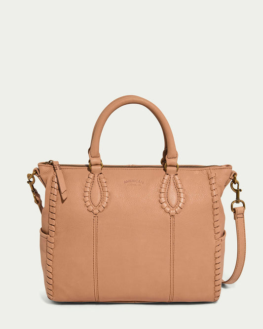 The Madison Satchel by American Leather Co. is a nutmeg glove leather handbag with elegant hand-woven details, two short handles, a detachable shoulder strap, and a zip closure for a sleek, structured appearance against a light background.