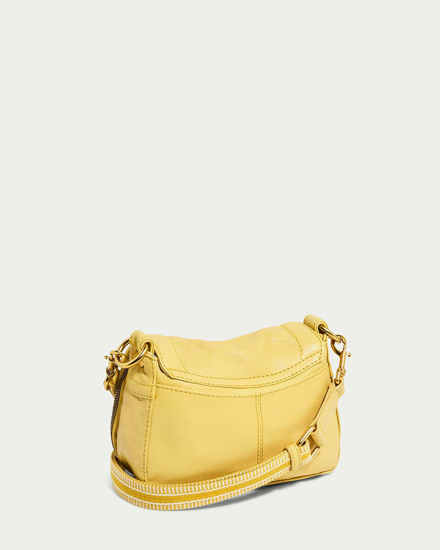 The Marino Mini Crossbody by American Leather Co. is a small yellow glove leather handbag featuring gold hardware, a detachable, adjustable strap with a white and yellow striped pattern, all set against a plain white background.