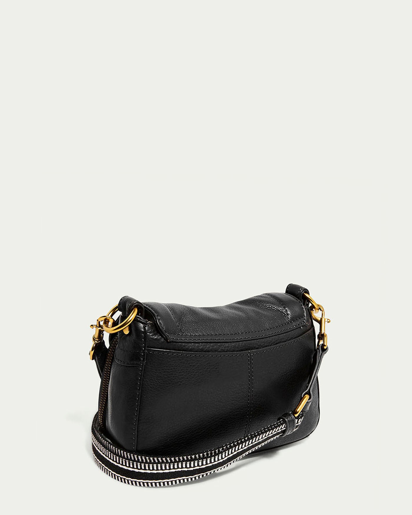 The Marino Mini Crossbody by American Leather Co. is a stylish black leather handbag crafted from luxurious glove leather. It features a gold chain strap, elegant gold hardware on each side, and a zippered closure against a plain white background with an adjustable strap.