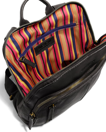 The Cleveland Midsize Backpack by American Leather Co. is a stylish black leather backpack featuring a zippered front pocket, an open main compartment lined with colorful striped fabric in pink, yellow, and blue, and a zippered interior pocket. The backpack is designed with gold-toned zippers, a top handle, and multiple zip compartments for added convenience.