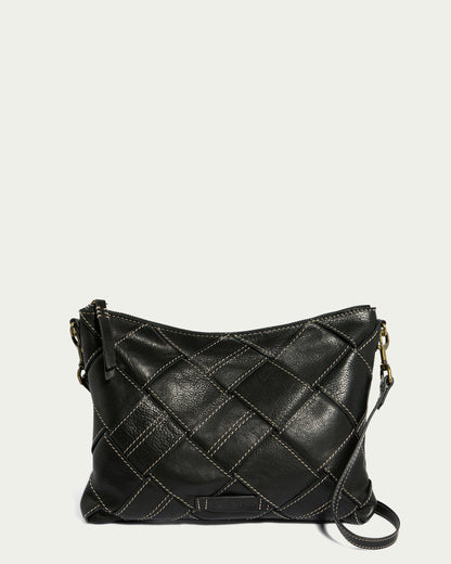 An American Leather Co. Mercer Woven Convertible Clutch in black, featuring a quilted diamond design and a detachable strap, showcased against a simple light backdrop.